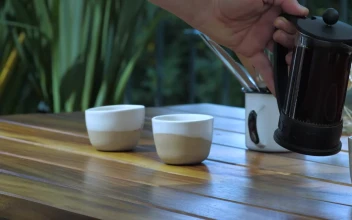 Stock Video A Waiter Serves Coffee To A Customer For PC