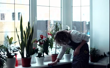 Stock Video A Tired Woman Cleaning The Home For PC