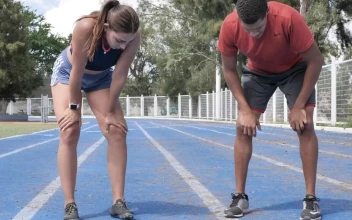Stock Video A Sports Boy And A Girl Exhausted After Running For PC