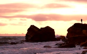 Stock Video A Silhouette Of A Person Over A Rock In The For PC