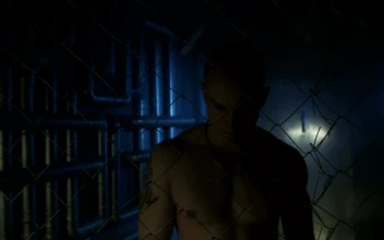 Stock Video A Shirtless Man With Metal Chain Behind The Fence For PC