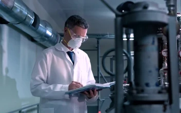 Stock Video A Scientist With A Face Mask On The Laboratory For PC