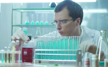 Stock Video A Scientist Experimenting With Tubes On The Lab For PC