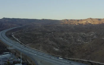 Stock Video A Road That Surrounds An Area Of Small Mountains For PC