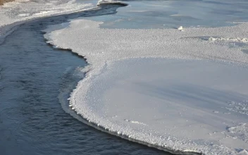 Stock Video A River Flowing Between Frozen Water For PC