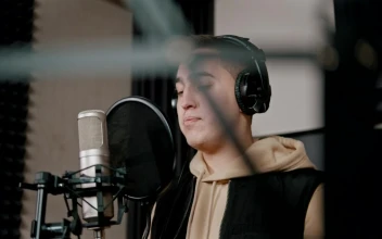 Stock Video A Rapper With Headphones Recording In The Studio For PC