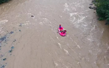 Stock Video A Pink Boat Rafting In A Wild River For PC