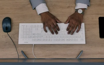 Stock Video A Persons Hands Typing On A Wifi Keyboard For PC
