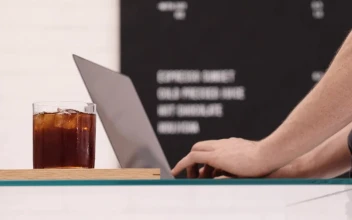 Stock Video A Person Working While Drinking Coffee For PC