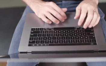 Stock Video A Person Typing On A Laptop Top View For PC