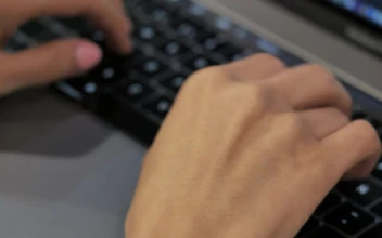 Stock Video A Person Typing On A Laptop For PC