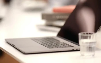 Stock Video A Person Typing In A Laptop At A Coffee Shop For PC