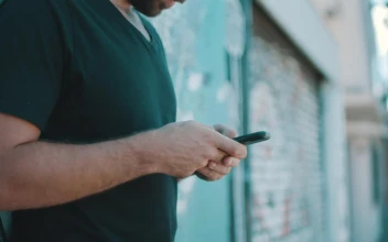 Stock Video A Person Texting On A Smartphone At The Street For PC