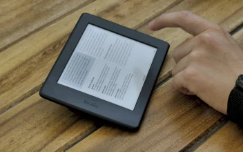 Stock Video A Person Reading An Ebook On A Tablet For PC