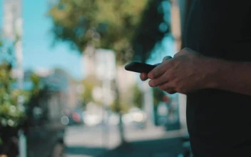 Stock Video A Person In The Street Messaging On A Smartphone For PC