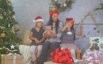 Stock Video A Mother With Her Two Daughters On Christmas Day For PC
