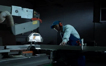 Stock Video A Man Working With A Saw In The Workshop For PC