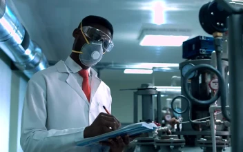 Stock Video A Man With A Face Mask Checking Laboratory For PC