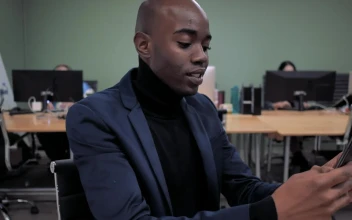 Stock Video A Man Wearing A Suit Works At The Office For PC