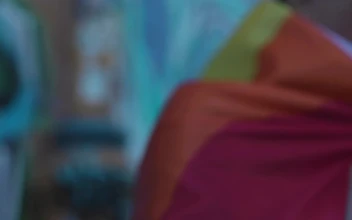 Stock Video A Man Wearing A Rainbow Flag Cape For PC