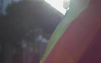 Stock Video A Man Wearing A Rainbow Flag As A Cape For PC