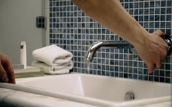 Stock Video A Man Washes His Face In The Bathroom Sink For PC