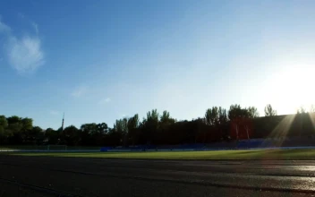 Stock Video A Man Trainign In A Running Track Field For PC
