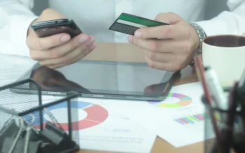 Stock Video A Man Texting On The Phone While Holding A Credit For PC