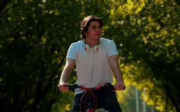 Stock Video A Man Riding A Bike Stops To Look At His For PC