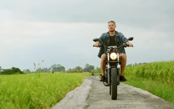 Stock Video A Man Riding A Bicycle Near A Farm In The For PC