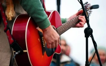 Stock Video A Man Playing The Guitar On Stage In A Festival For PC