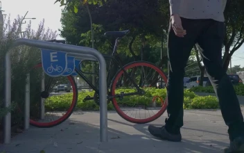 Stock Video A Man Parking His Bicycle In The Street For PC