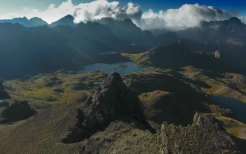 Stock Video A Man On Top Of A Mountain Peak For PC