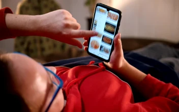 Stock Video A Man Lying On The Bed Scrolling Food Pictures On For PC