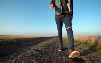 Stock Video A Man Is Walking On Rural Path For PC