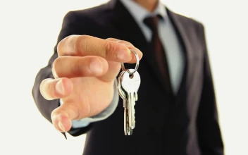 Stock Video A Man In Suit Handing Keys To The Lens For PC