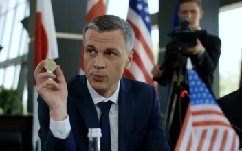 Stock Video A Man Holding A Bitcoin In A Conference For PC