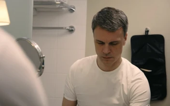 Stock Video A Man Brushes His Teeth In The Bathroom For PC