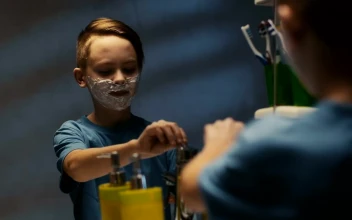 Stock Video A Little Boy Is Shaving In Front Of The Mirror For PC