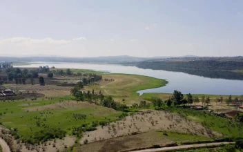 Stock Video A Lake Next To Agriculture Fields For PC