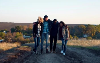 Stock Video A Group Of Friends Hugging And Walking On A Path For PC