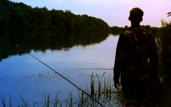 Stock Video A Fisherman Stands On The Riverside For PC