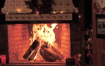 Stock Video A Fireplace Lit At Christmas Time For PC