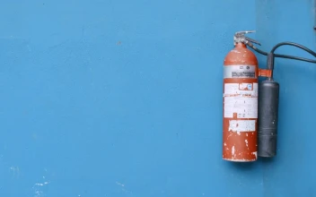 Stock Video A Fire Extinguisher Hanging On The Wall For PC
