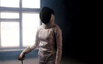 Stock Video A Fencer Putting The Sword Behind The Shoulders For PC