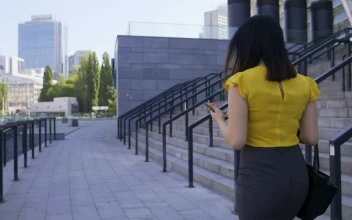 Stock Video Business Woman Using Her Cell For PC