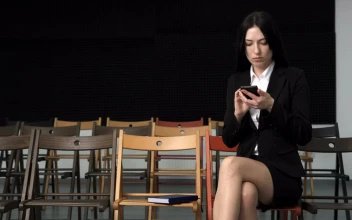 Stock Video Business Woman Texting At A Empty Seminar For PC