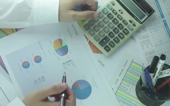 Stock Video Business Man With Calculator And Charts For PC