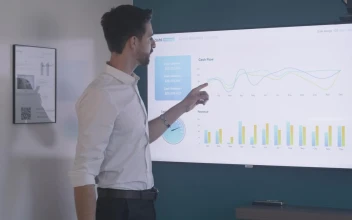 Stock Video Business Man Exposing Graphs For PC