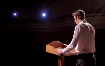 Stock Video Business Conference Speaker At Podium Gestures To Audience For PC